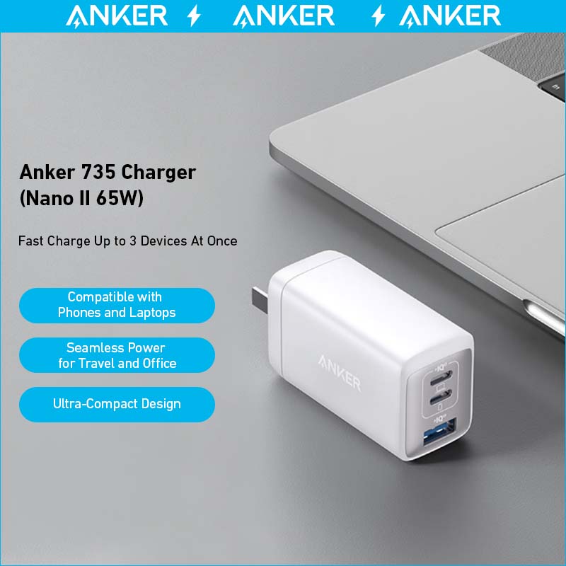 Anker 735 Charger (Nano II 65W) with laptop on gray surface