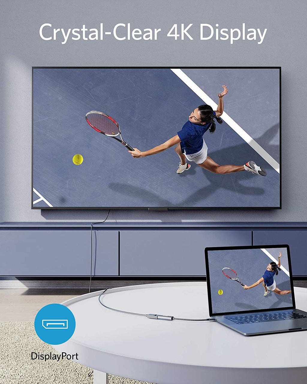 4K display showing a tennis player on a screen with a laptop displaying the same image.