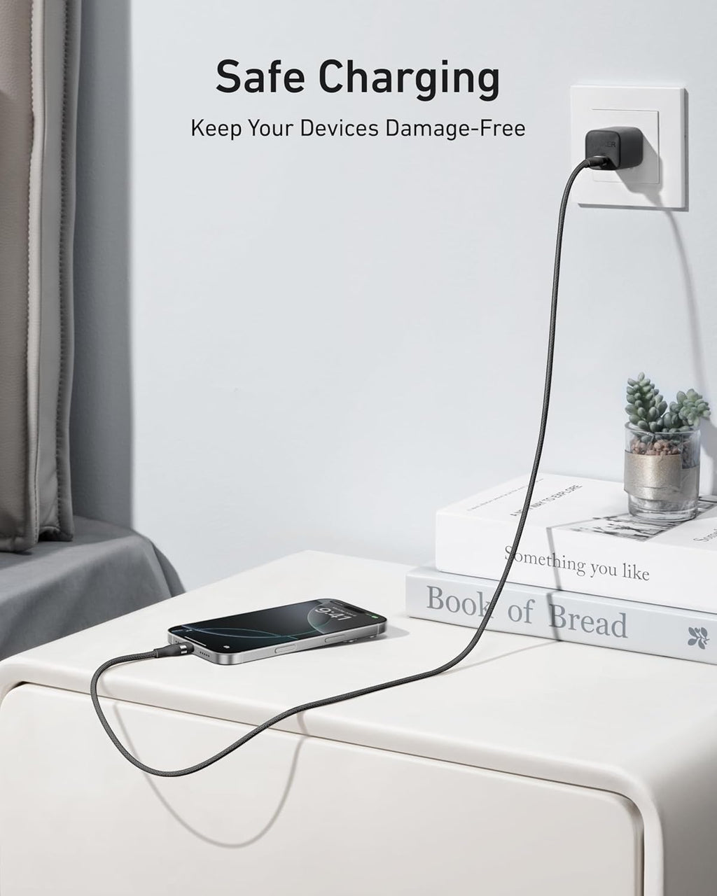 Phone being charged on a nightstand with text 'Safe Charging' and 'Keep Your Devices Damage-Free'.