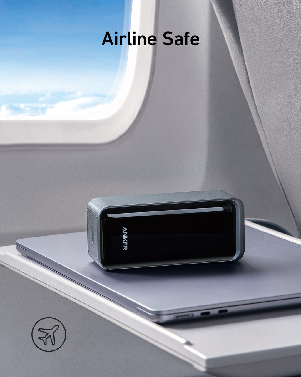 Anker power bank on an airplane tray table with 'Airline Safe' text above.