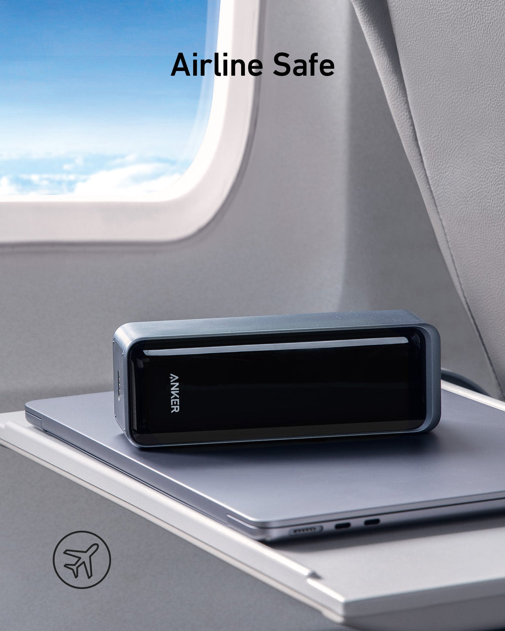 Anker power bank on a laptop in an airplane seat with 'Airline Safe' text.