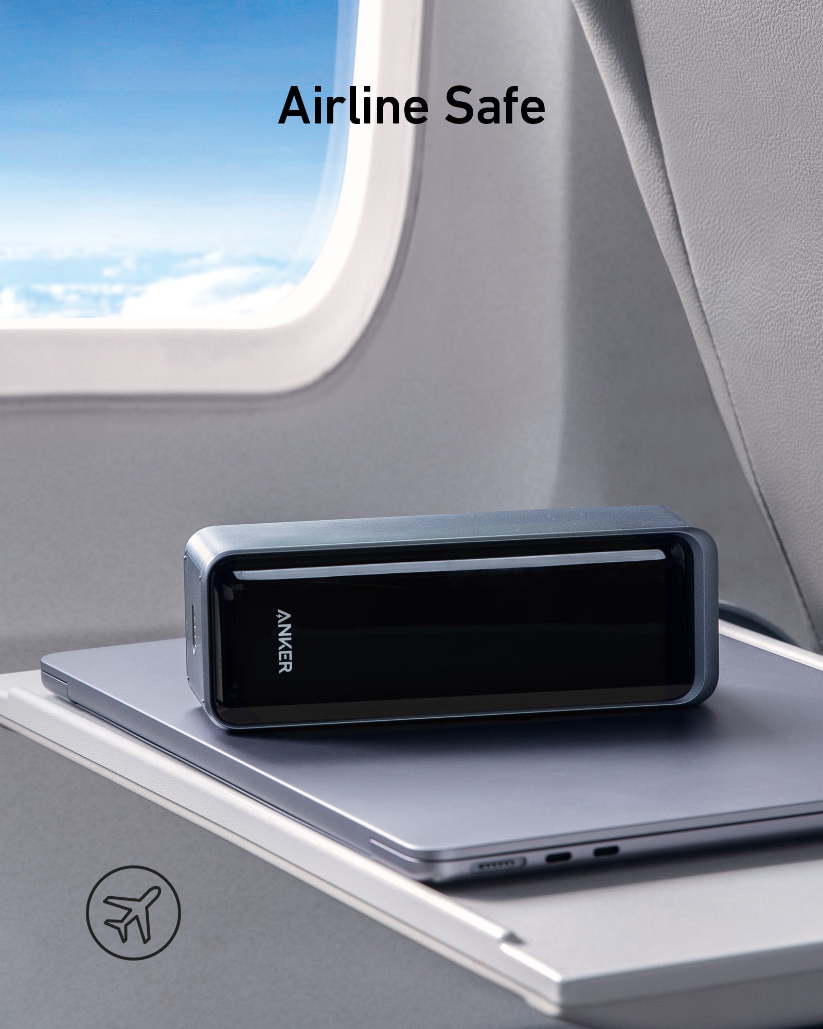Anker power bank on a laptop in an airplane seat with 'Airline Safe' text.