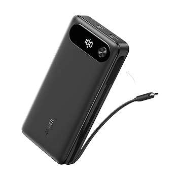 Black power bank with digital display and USB cable on a white background