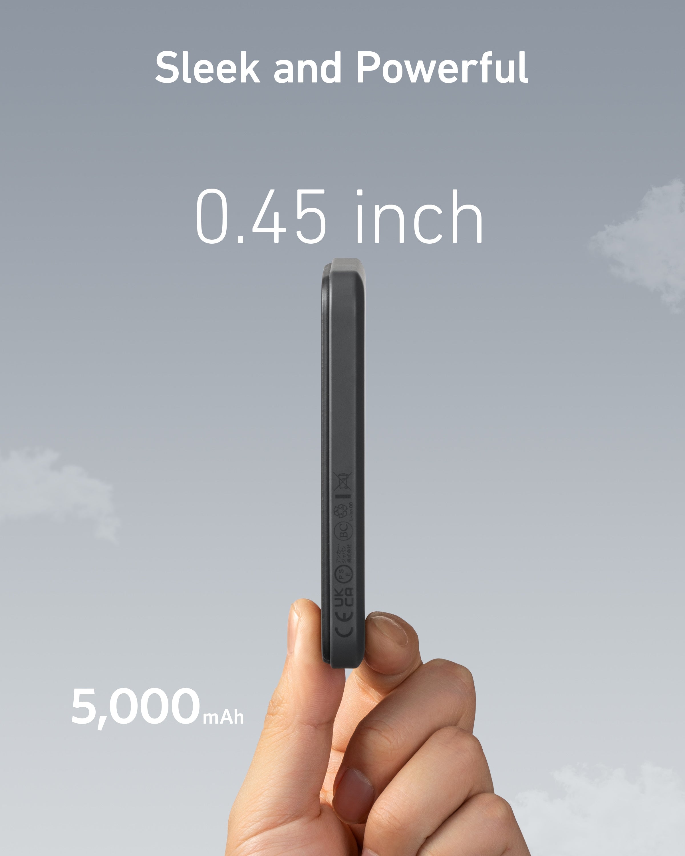 Hand holding a small device with text indicating thickness and battery capacity on a gray background