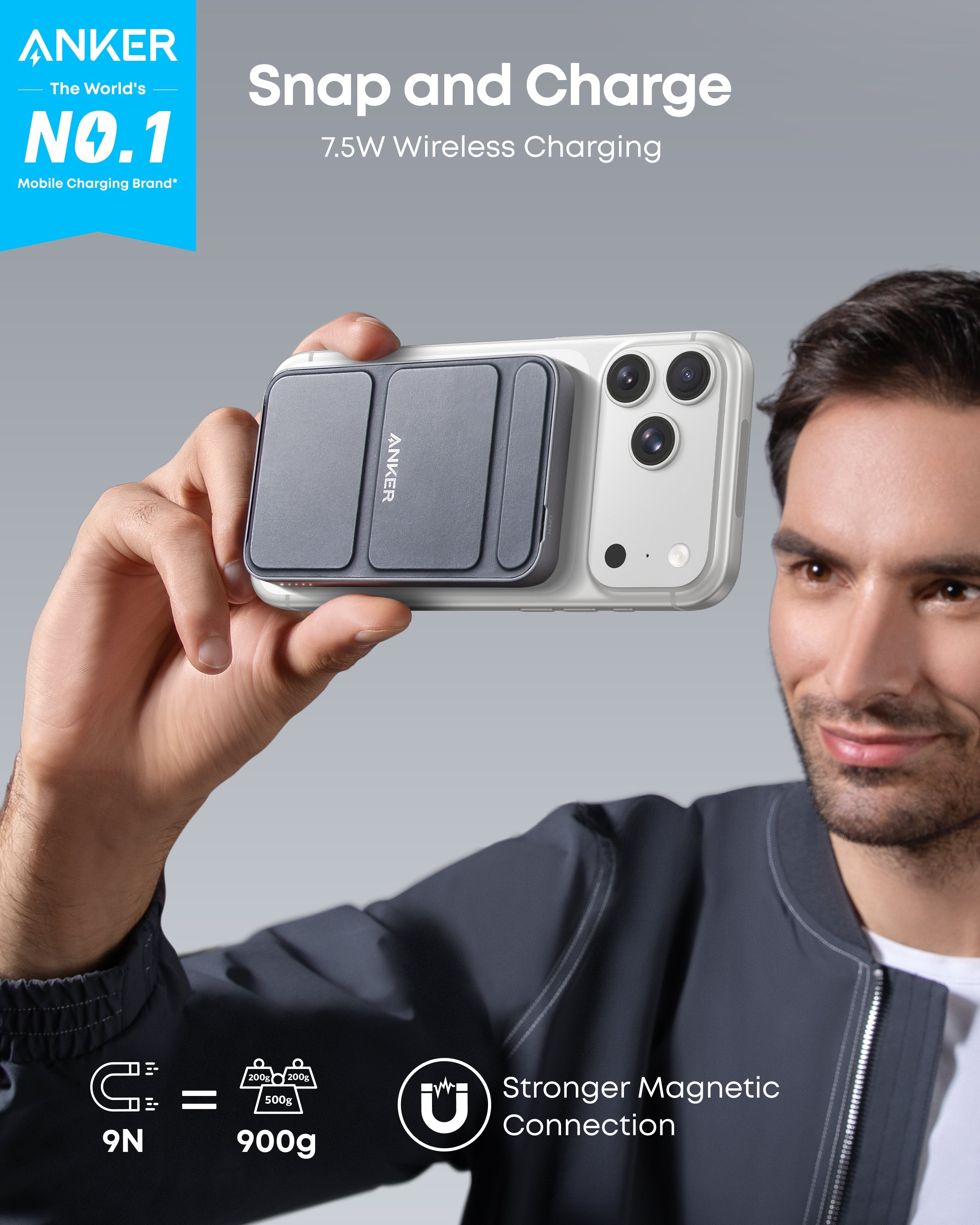 Person holding a phone with an Anker wireless charging case against a gray background