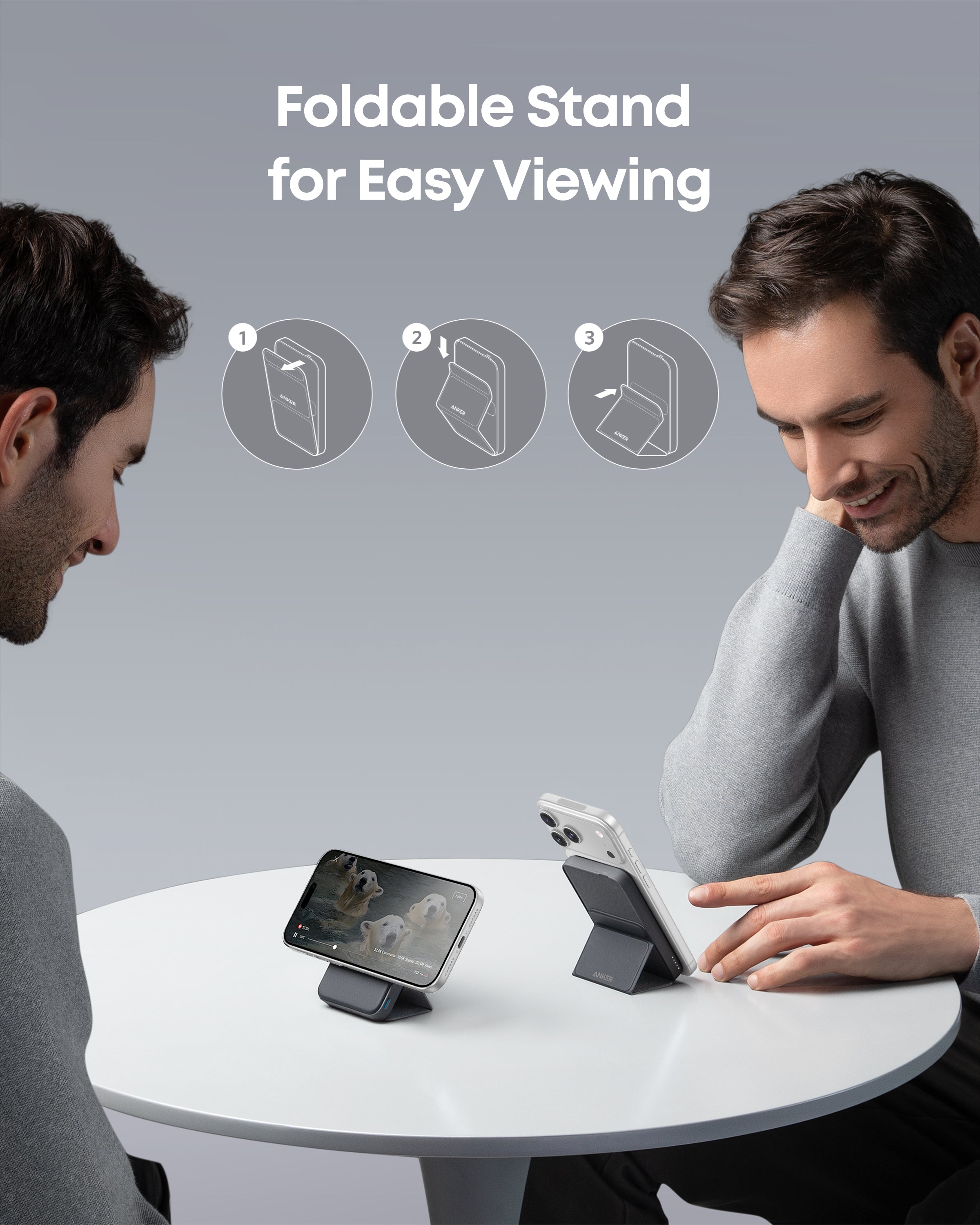 Two men using foldable stands to view smartphone screens at a table with text 'Foldable Stand for Easy Viewing'.