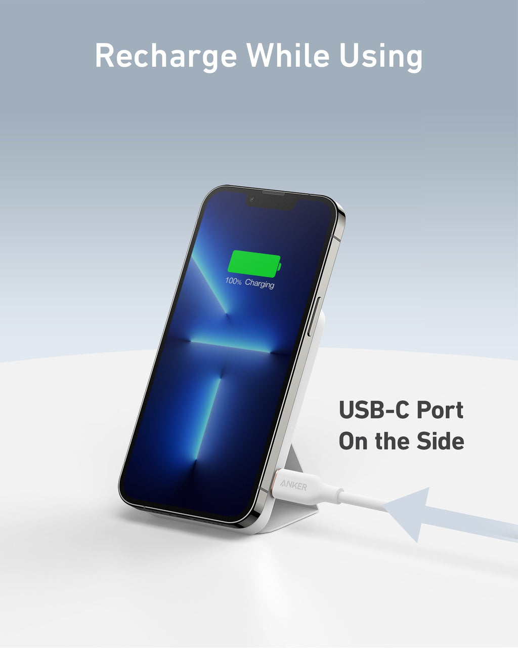 Smartphone with a charging cable connected to a USB-C port on a light gray background.