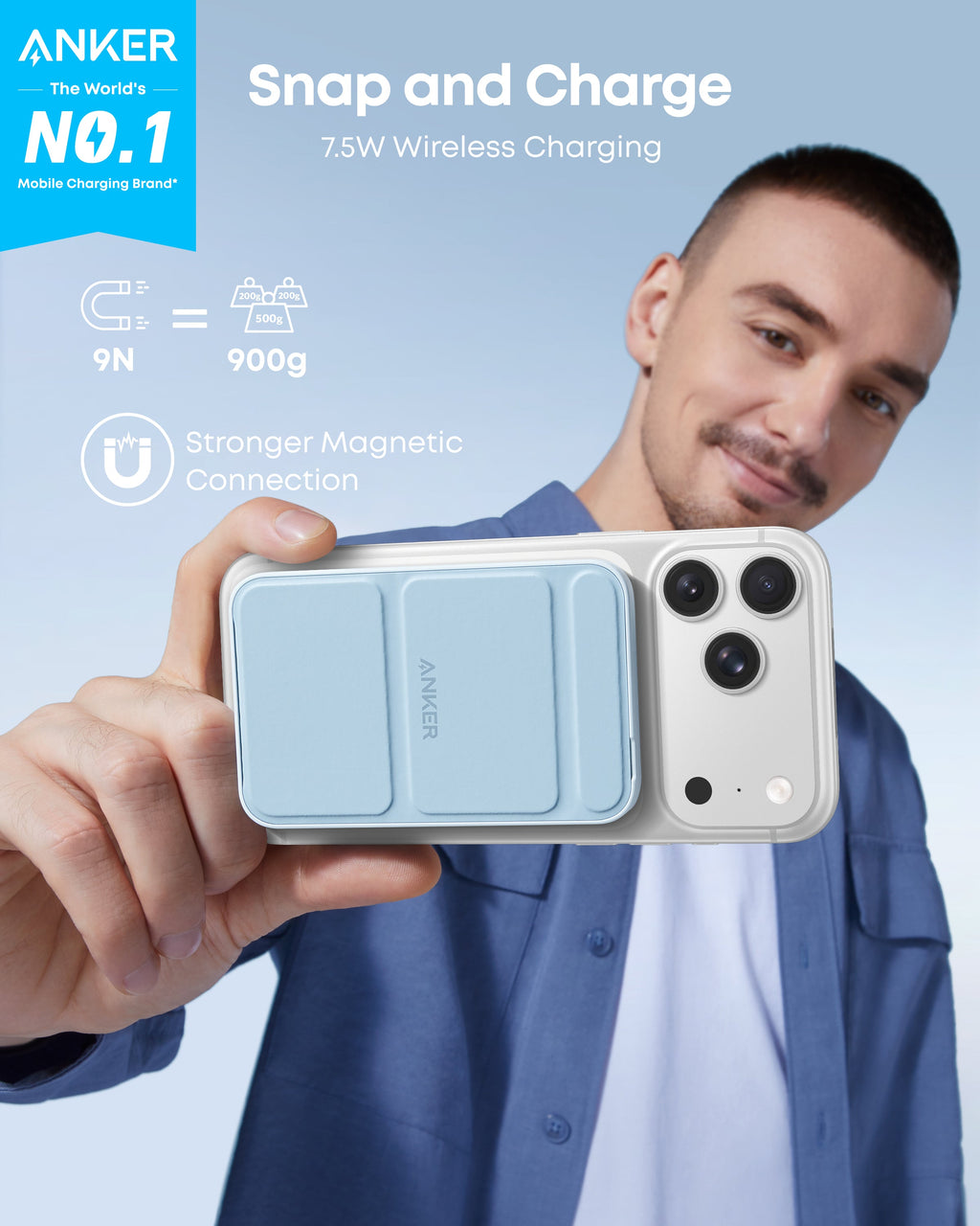 Person holding a phone with Anker wireless charging case against a light blue background