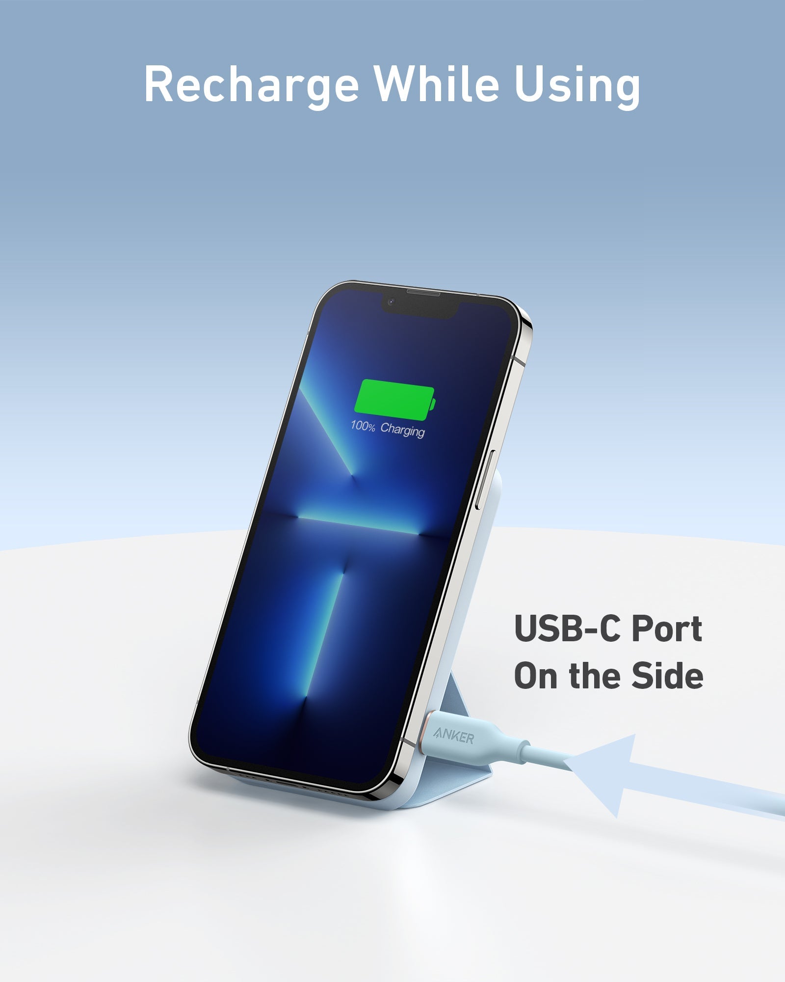 Smartphone with a charging cable on a white surface, featuring a USB-C port.