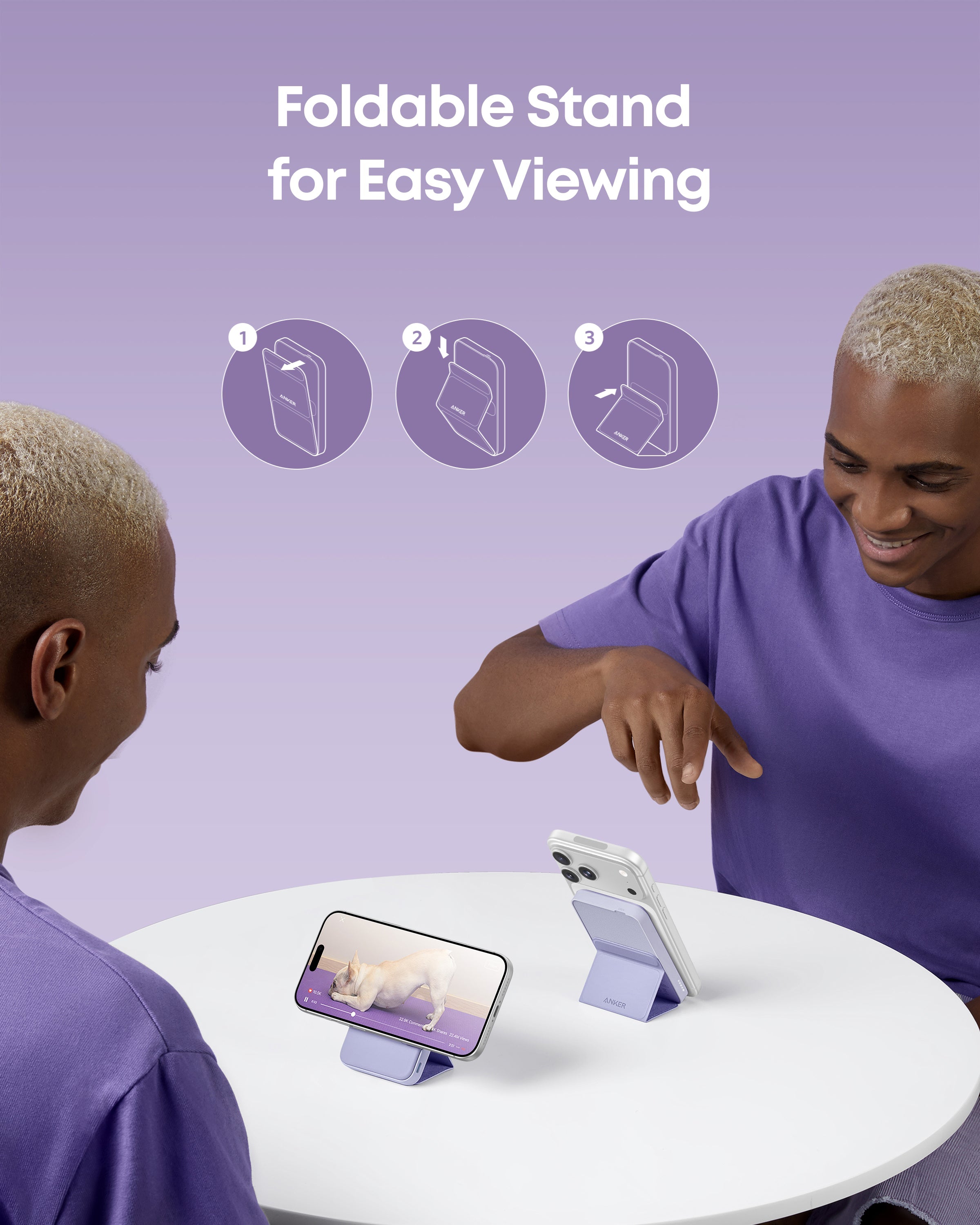 Two people using a foldable stand for easy viewing on a purple background