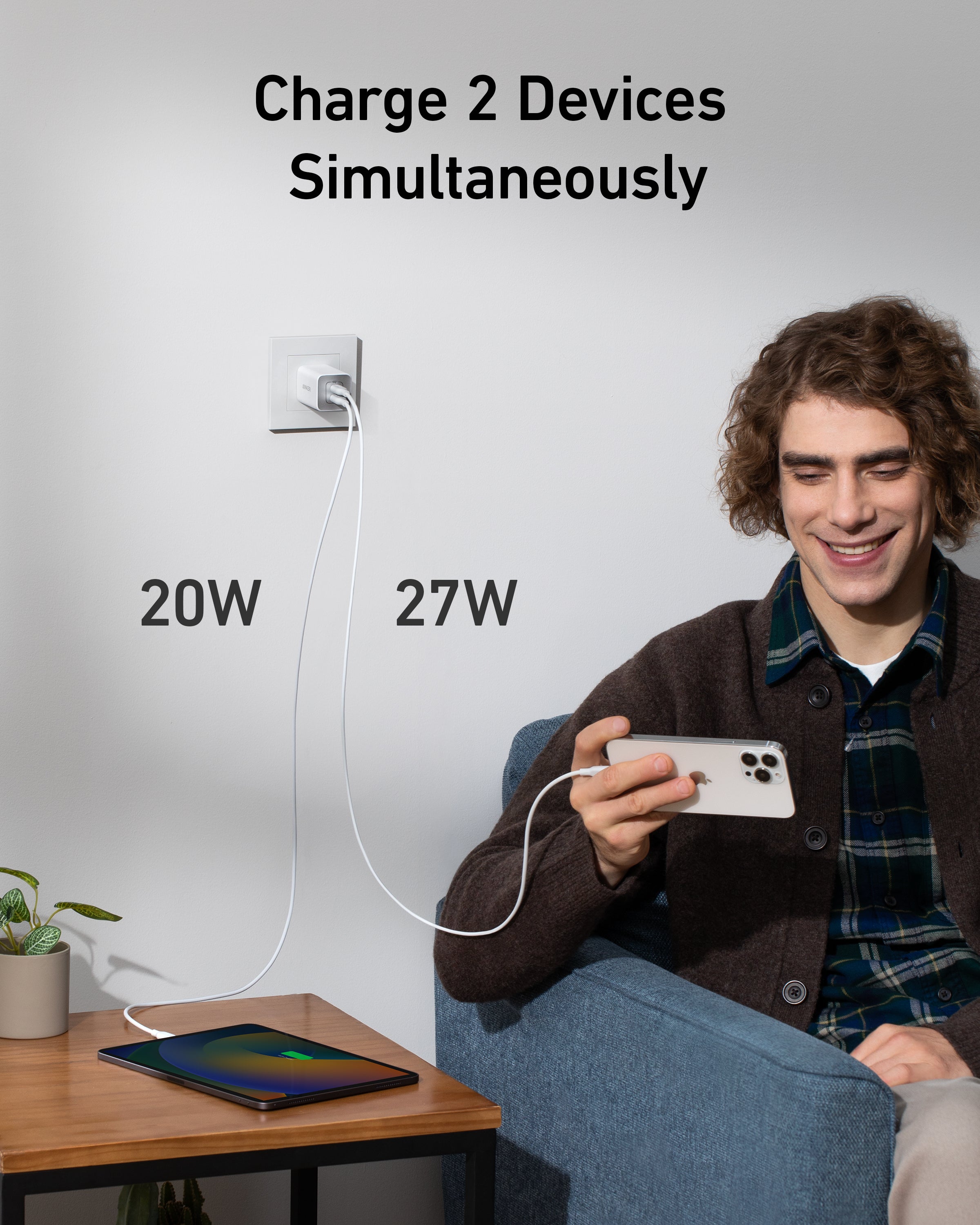Person using a device with text indicating it can charge 2 devices simultaneously at 20W and 27W.