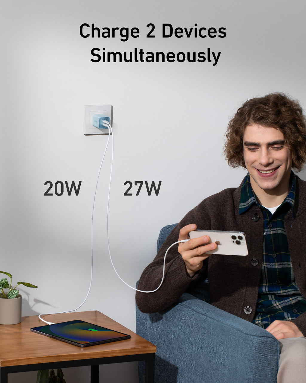 Person using a device with text indicating it can charge 2 devices simultaneously at 20W and 27W.