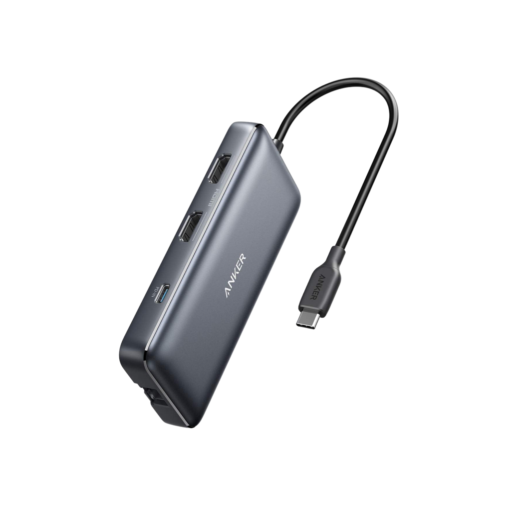 Gray USB hub with multiple ports and a cable on a white background