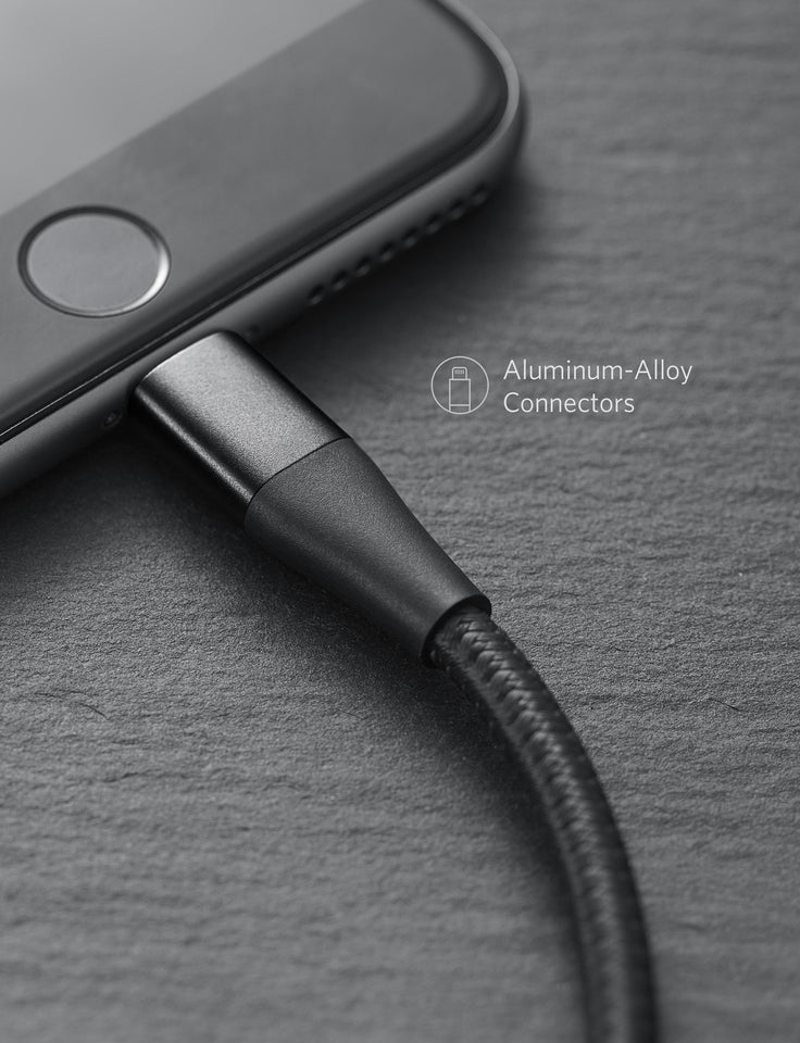 Close-up of a phone with a charging cable on a gray surface, featuring 'Aluminum-Alloy Connectors' text.