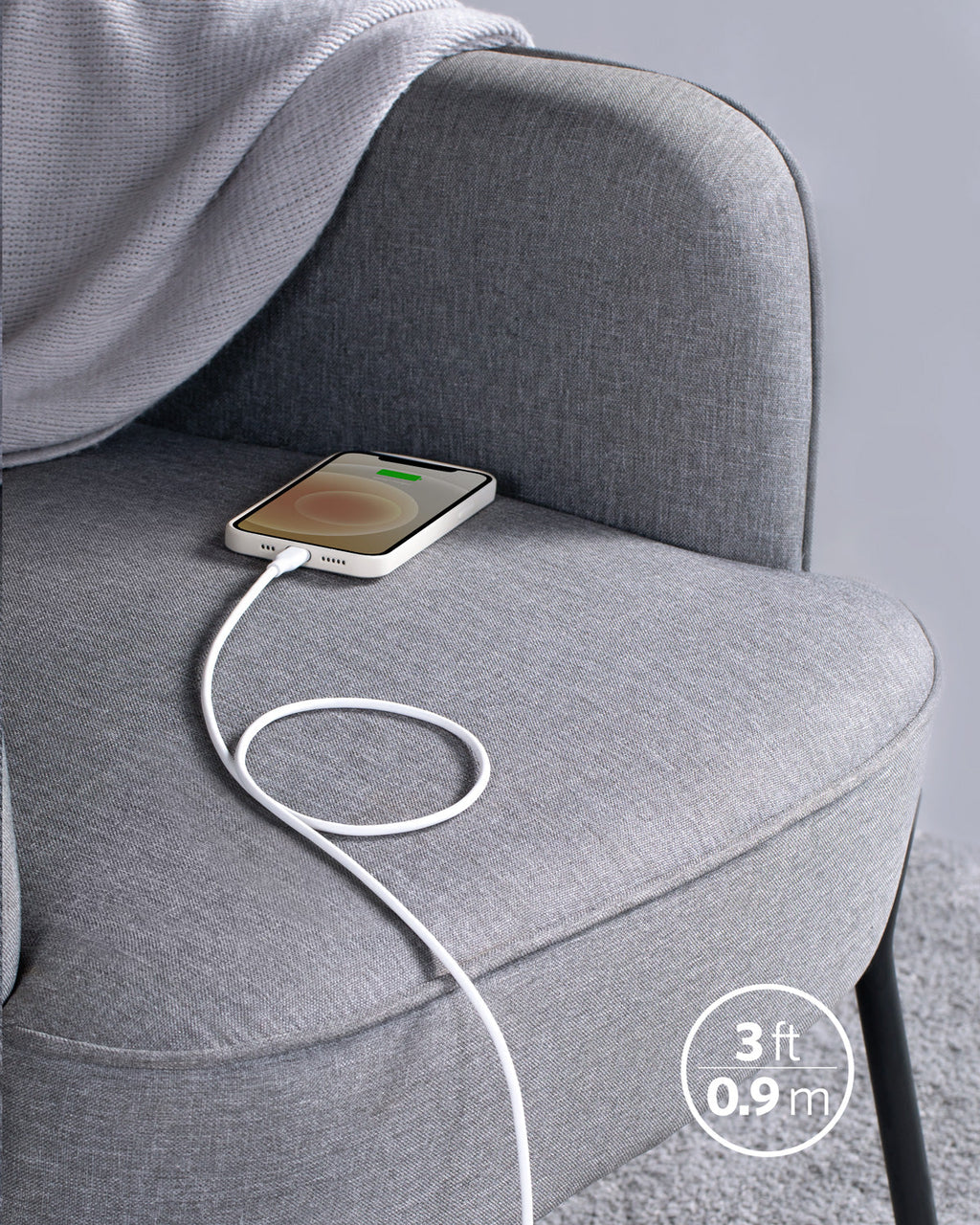 Phone with a white cable on a gray chair, showing a 3-foot length measurement.