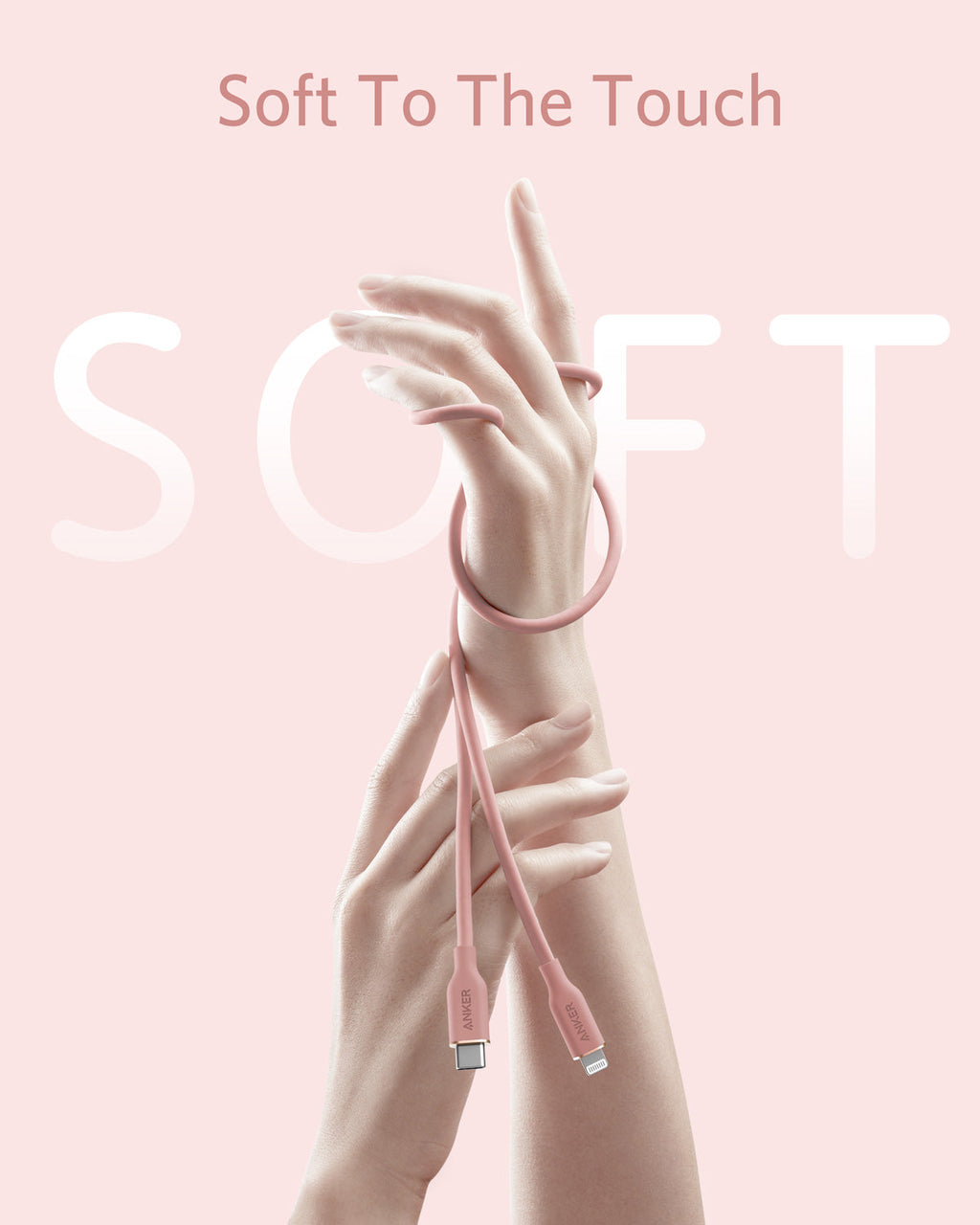Pink charging cable with hands holding it against a pink background, featuring the text 'Soft To The Touch'.