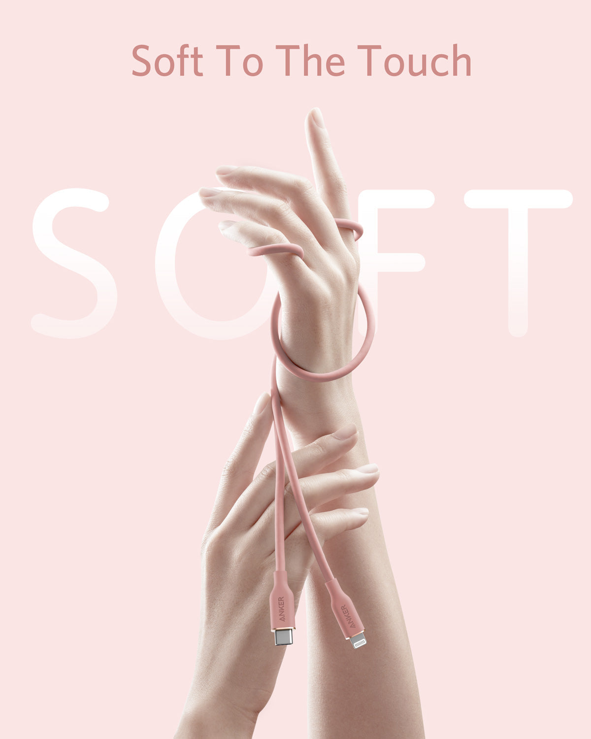 Pink charging cable with hands holding it against a pink background, featuring the text 'Soft To The Touch'.