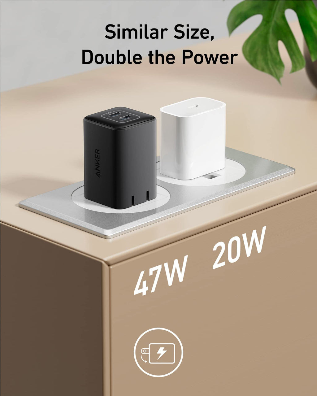 Two power adapters, one black and one white, on a surface with text indicating power ratings and a brand logo.