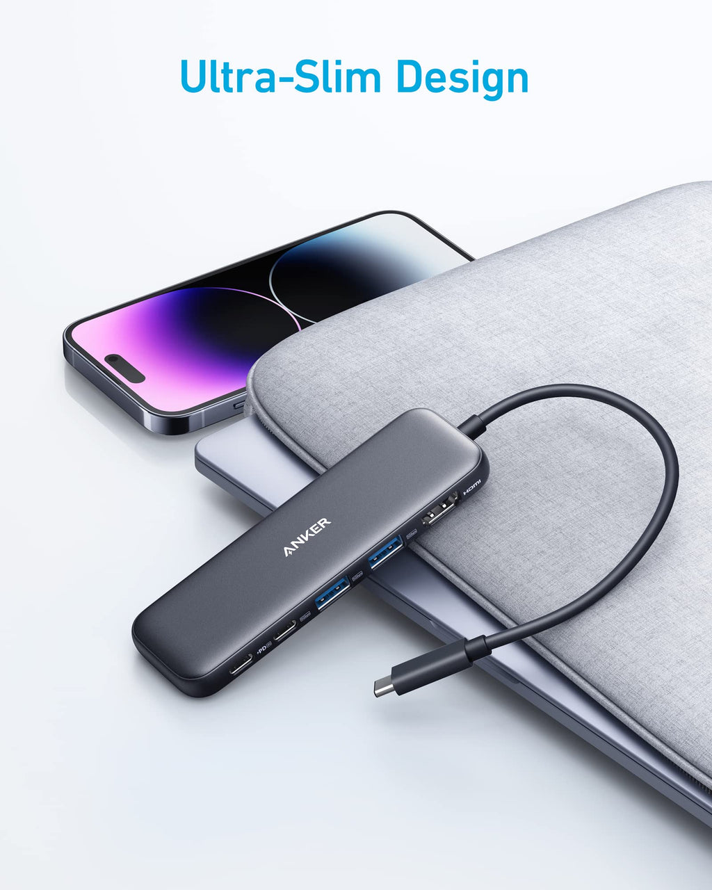 Anker USB hub with smartphone and laptop on a light gray background