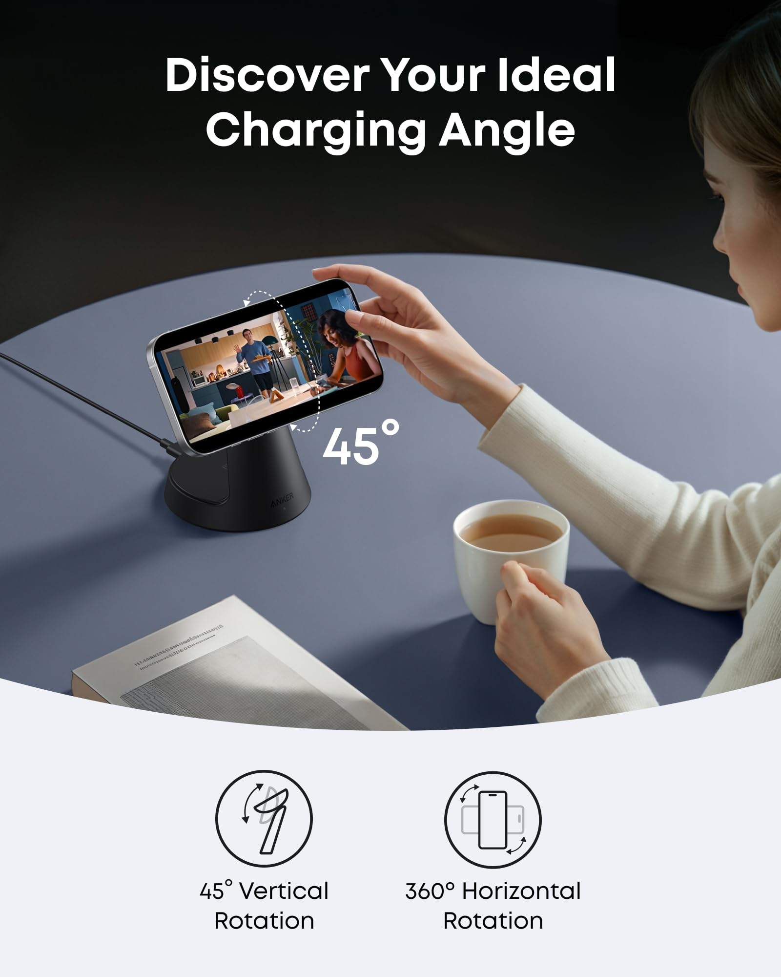 Person using a smartphone on a charging stand with 45-degree angle indicator, sitting at a table with a cup of coffee.