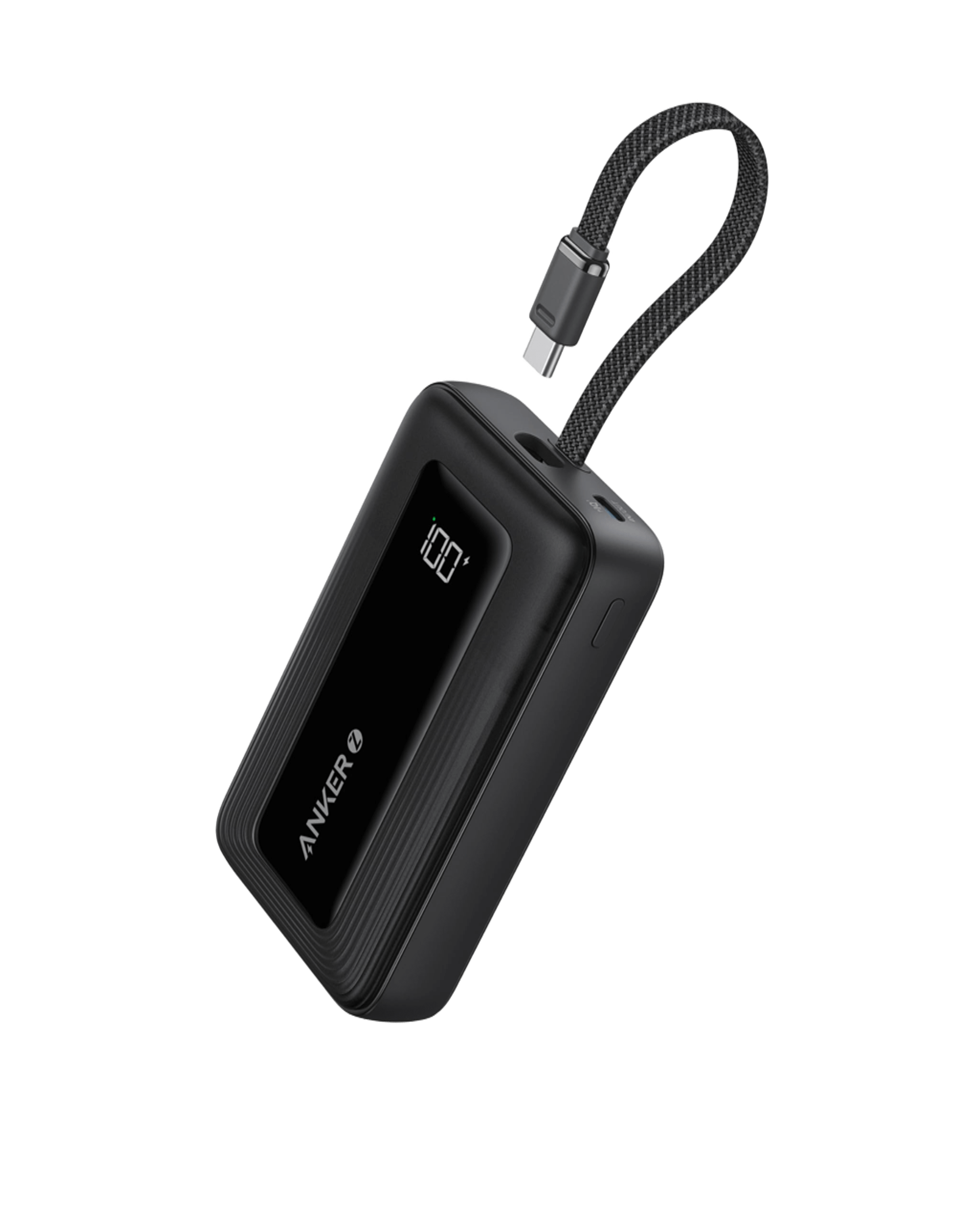 Black power bank with digital display and cable on a transparent background