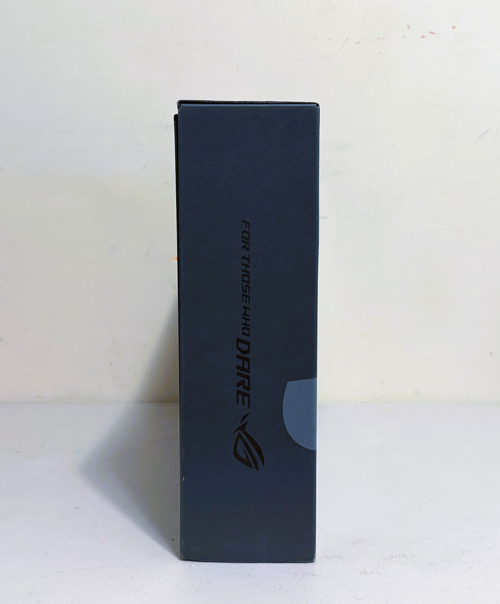 Black rectangular box with 'For Those Who Dare' text and logo on a white background