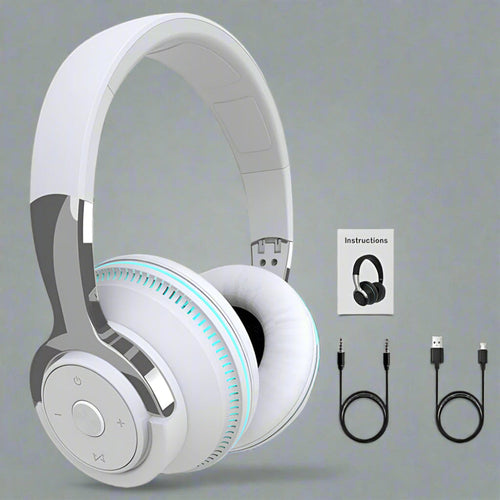 White headphones with USB cable and instruction sheet on a gray background