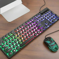 Gaming keyboard and mouse with RGB lighting on a wooden surface