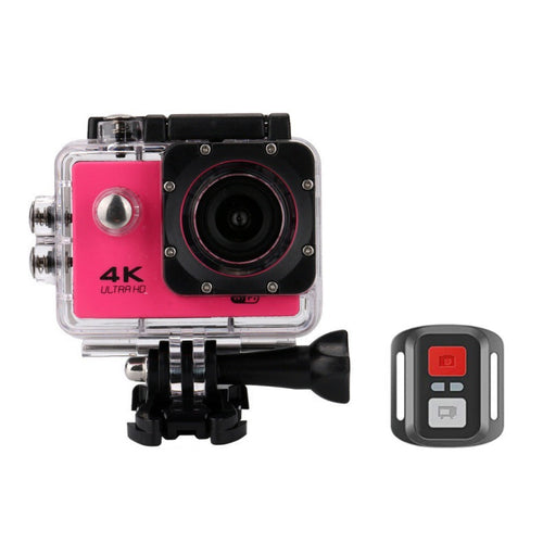 Action camera with pink front panel and remote control on a white background