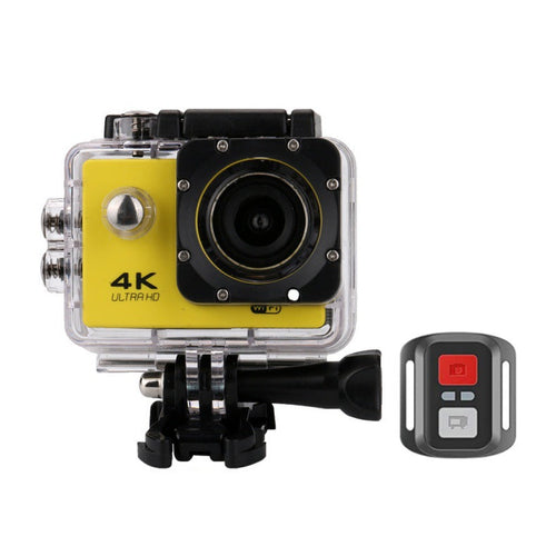 Action camera with yellow front panel and remote control on a white background