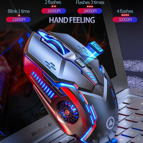 Gaming mouse with illuminated design on a laptop keyboard