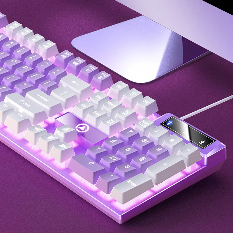 Gaming keyboard with RGB lighting on a purple surface