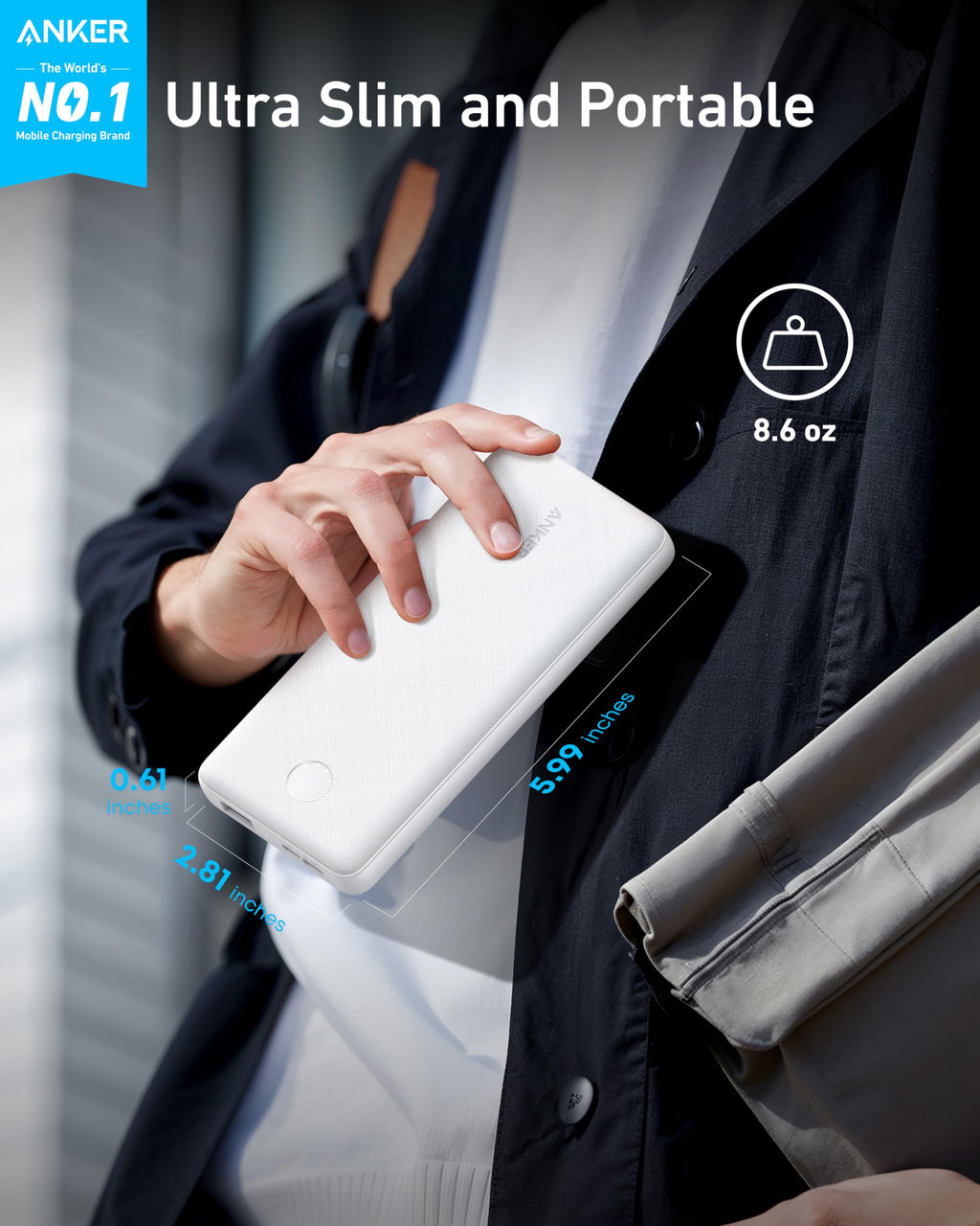 Person holding a white power bank with Anker branding, emphasizing ultra-slim and portable design.