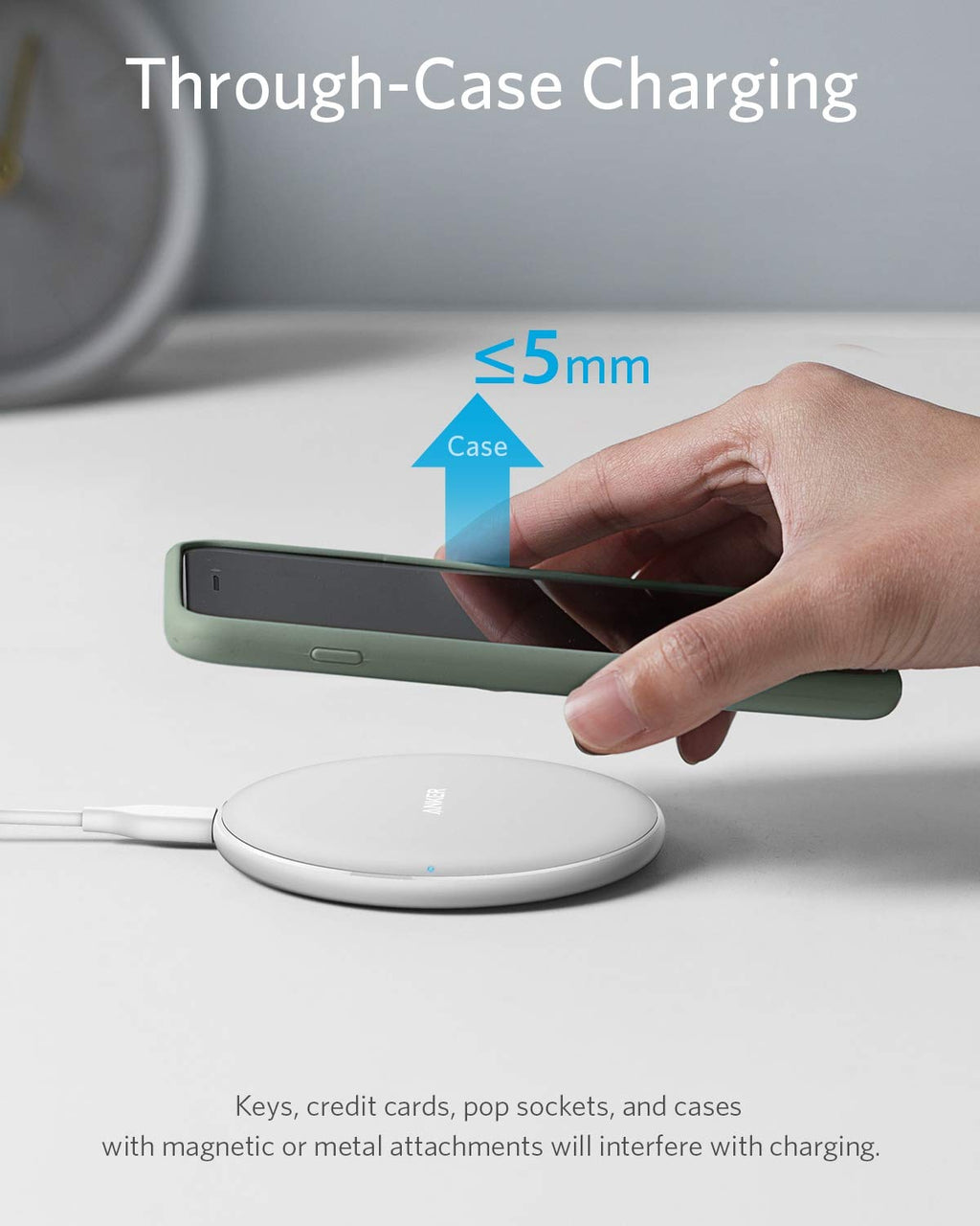 Person holding a phone above a wireless charging pad with text about through-case charging.