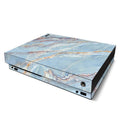 Gaming console with a marble pattern skin on a white background
