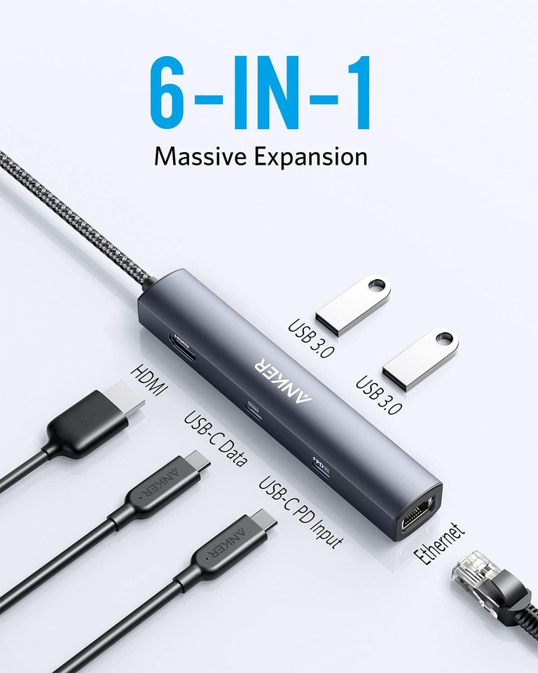 6-in-1 expansion device with multiple ports on a white background