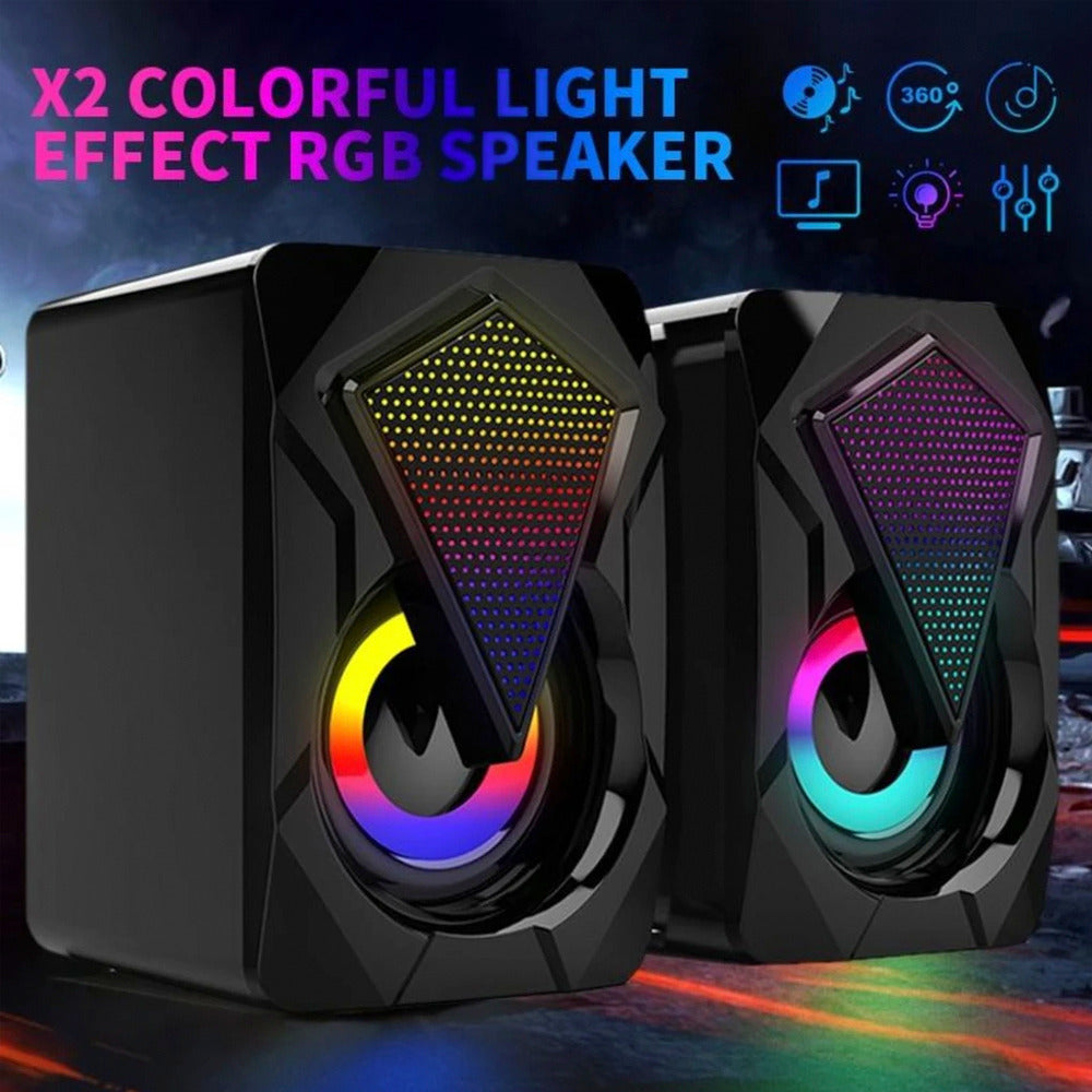 Pair of RGB speakers with colorful light effects on a dark background