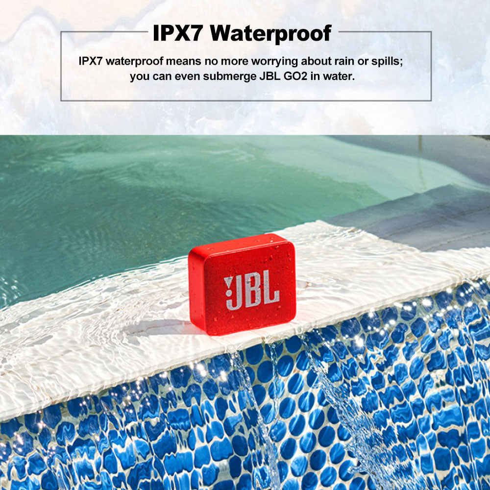 Red JBL speaker on a pool ledge with IPX7 waterproof text overlay