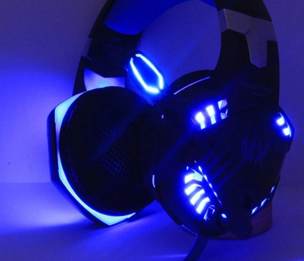 Black gaming headset with blue LED lights on a dark background