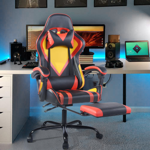 Gaming chair in a room with computer equipment on a desk.