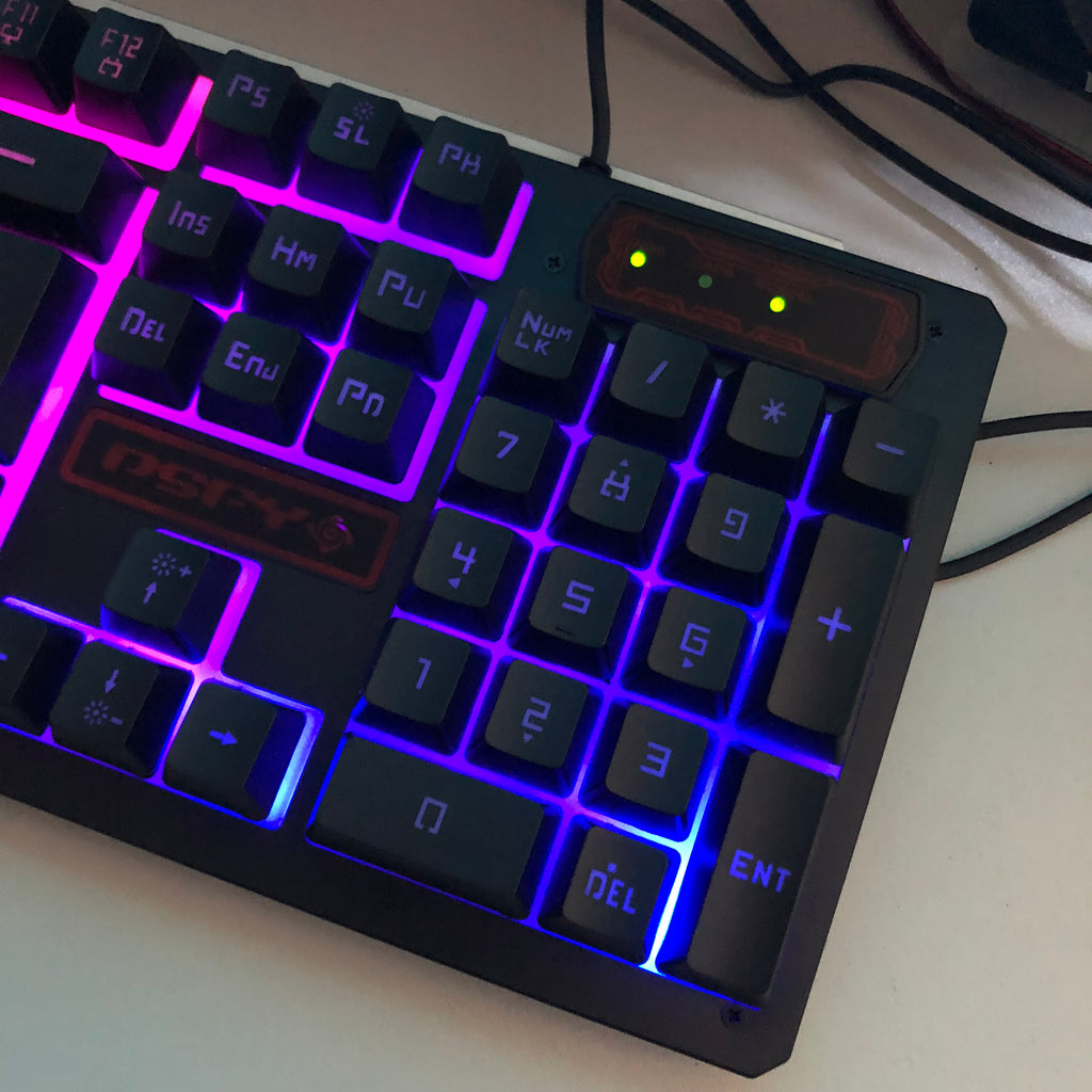 Mechanical keyboard with RGB lighting on a white surface