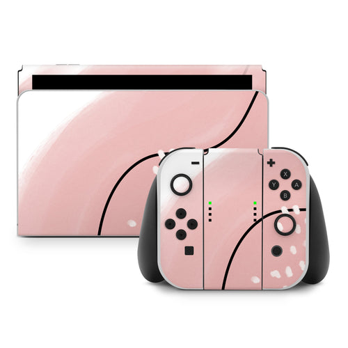 Pink gaming console and controller set on a white background