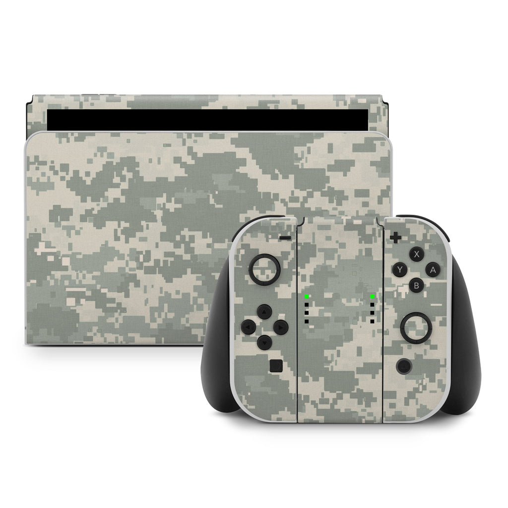 Nintendo Switch console and controllers with a camouflage skin on a white background