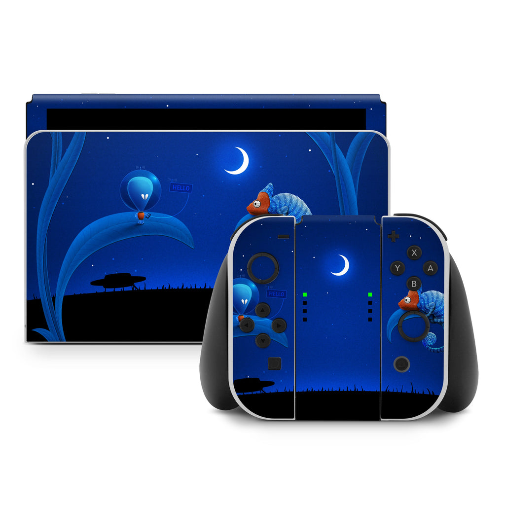 Gaming console set with underwater-themed design on screen and controllers.