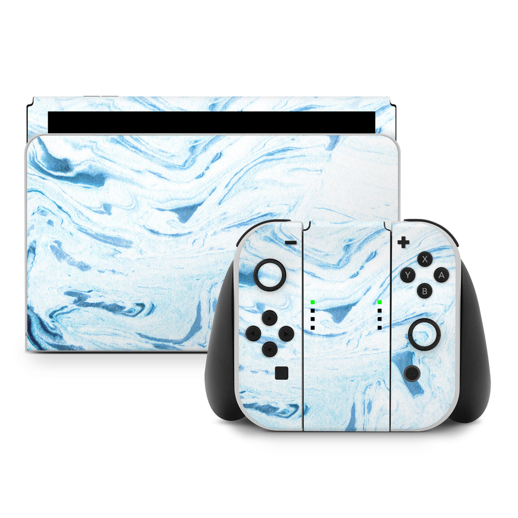 Gaming console and controllers with blue marble design on a white background