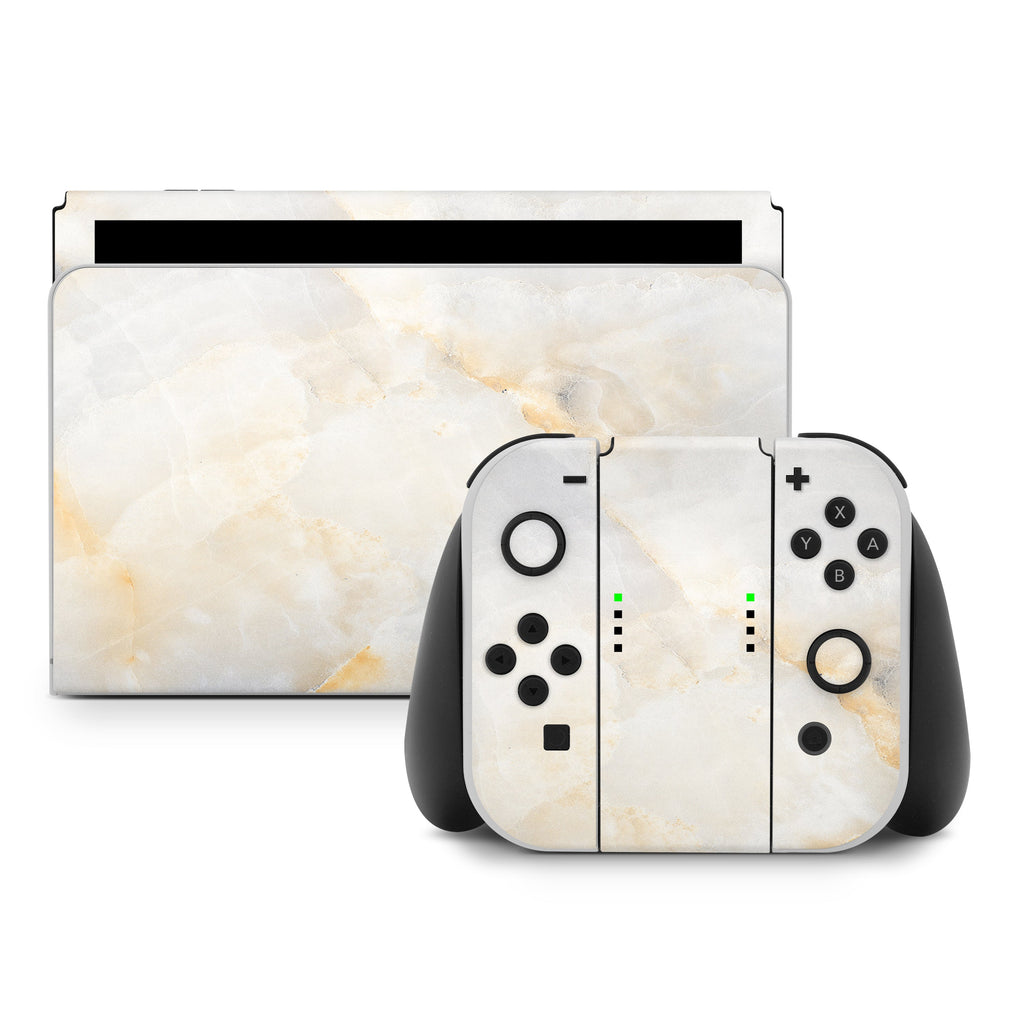 Gaming console and controllers with marble pattern on a white background