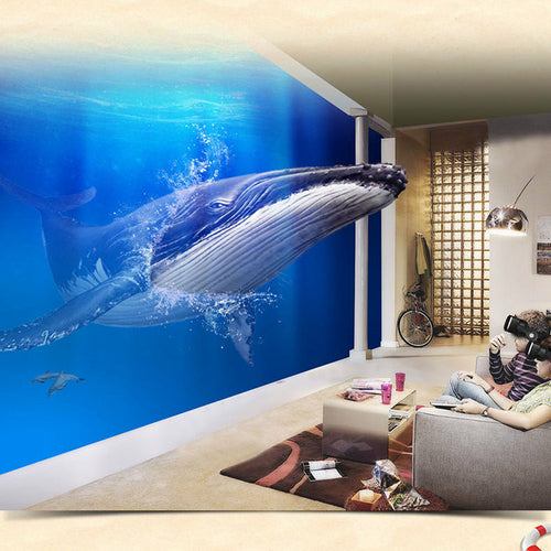 Living room with a large whale mural on the wall