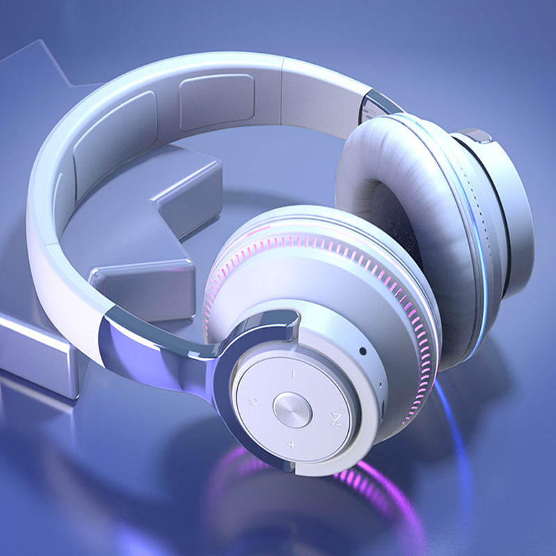 White headphones with pink accents on a blue gradient background