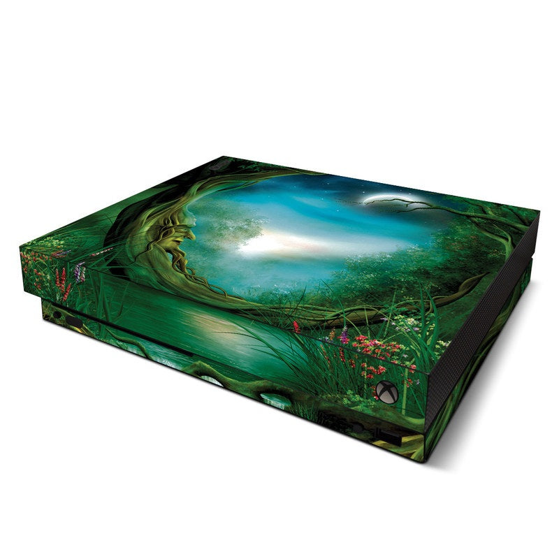 Gaming console with a nature-themed skin on a white background