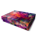 Gaming console with a colorful tie-dye skin on a white background